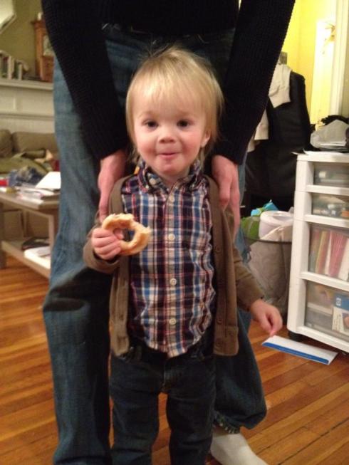 Unwilling to put down his bagel, even for a birthday picture.